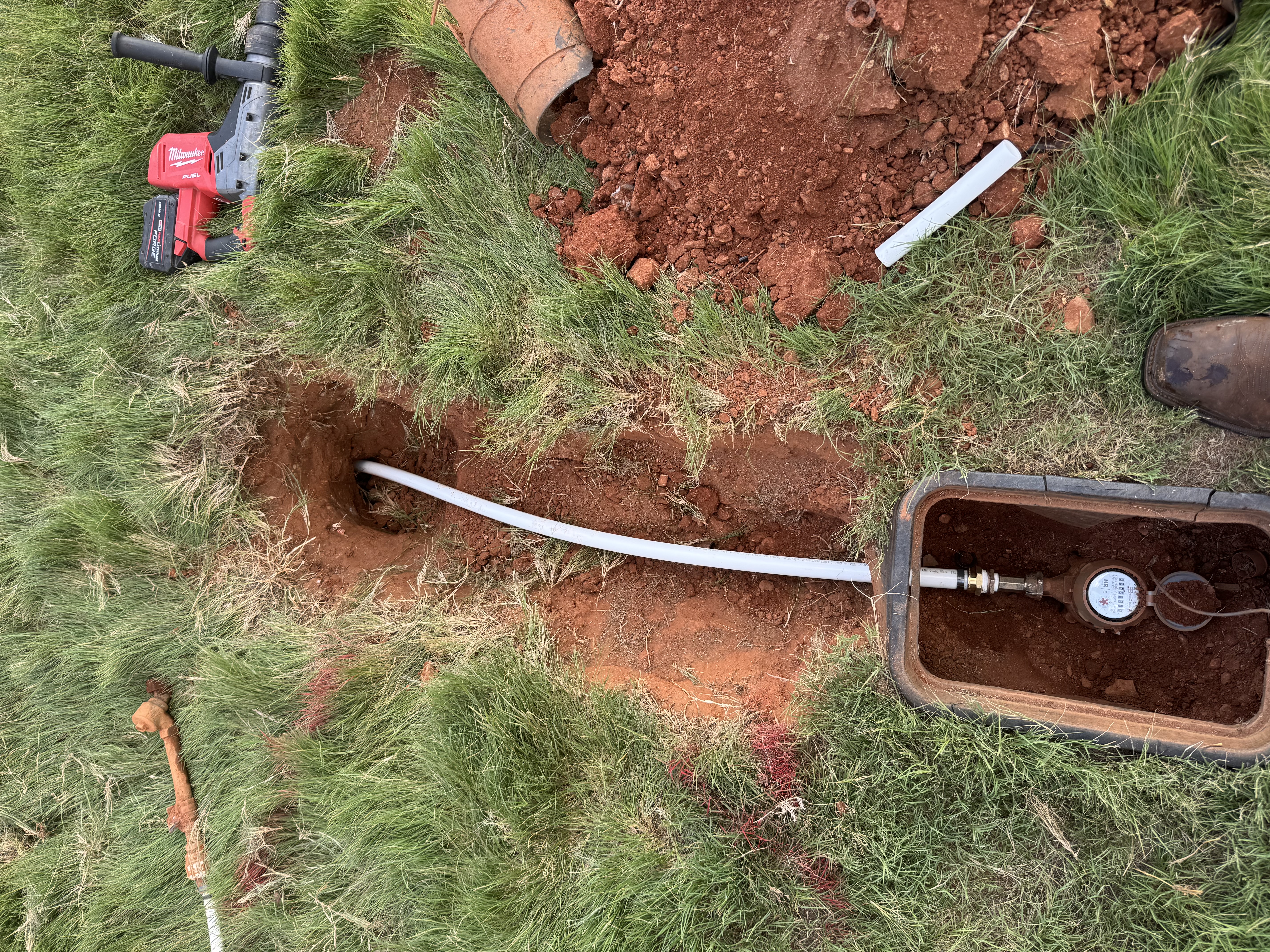 New seamless water line pulled into place and connected to the meter box