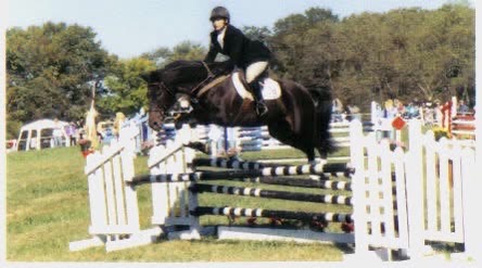 Nadeem Noon riding dressage on a dark horse