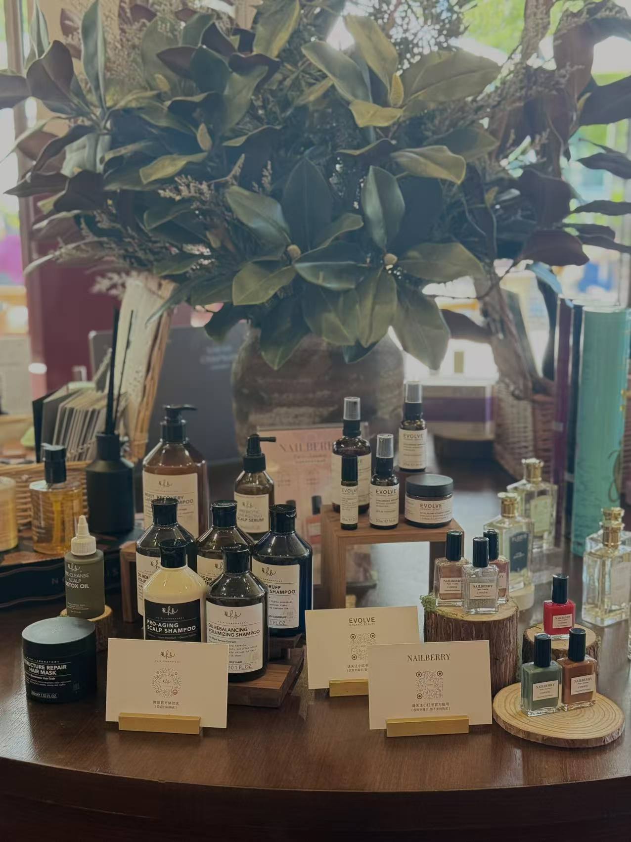Hair Laboratory, Evolve Organic Beauty and Nailberry sharing one table.