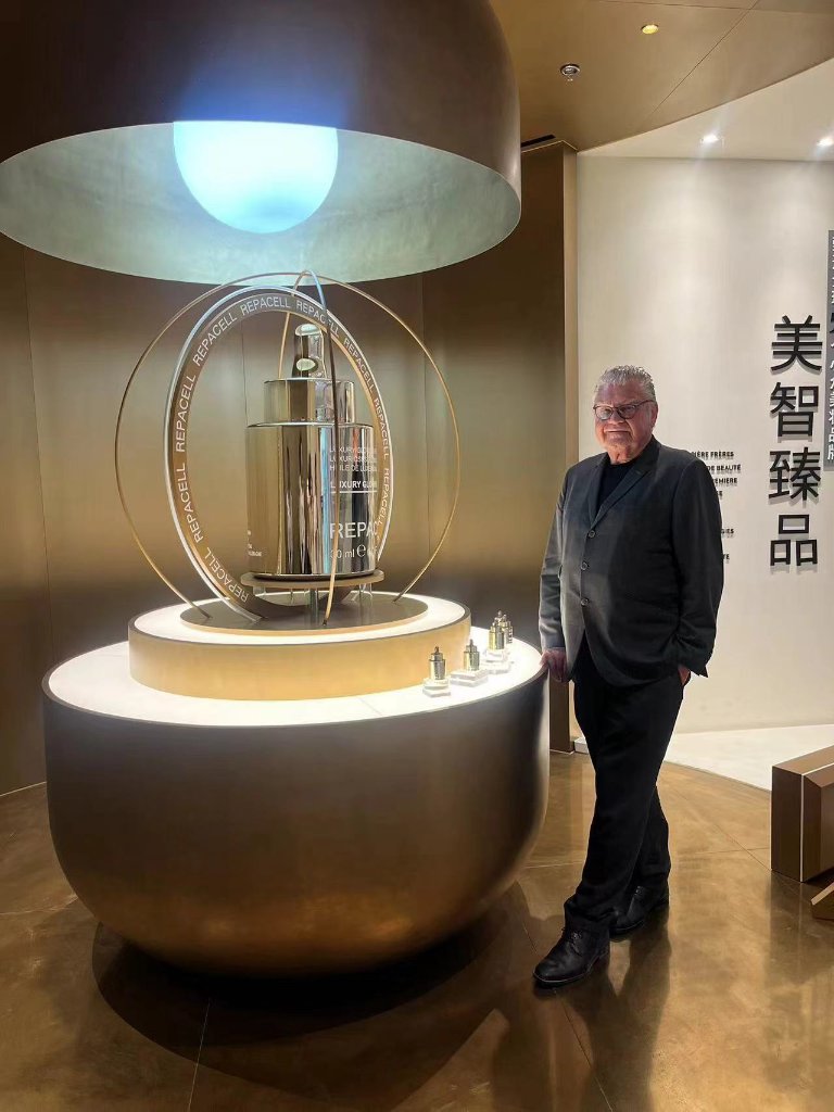 The founder beside the central display within the JOYCE BEAUTY store