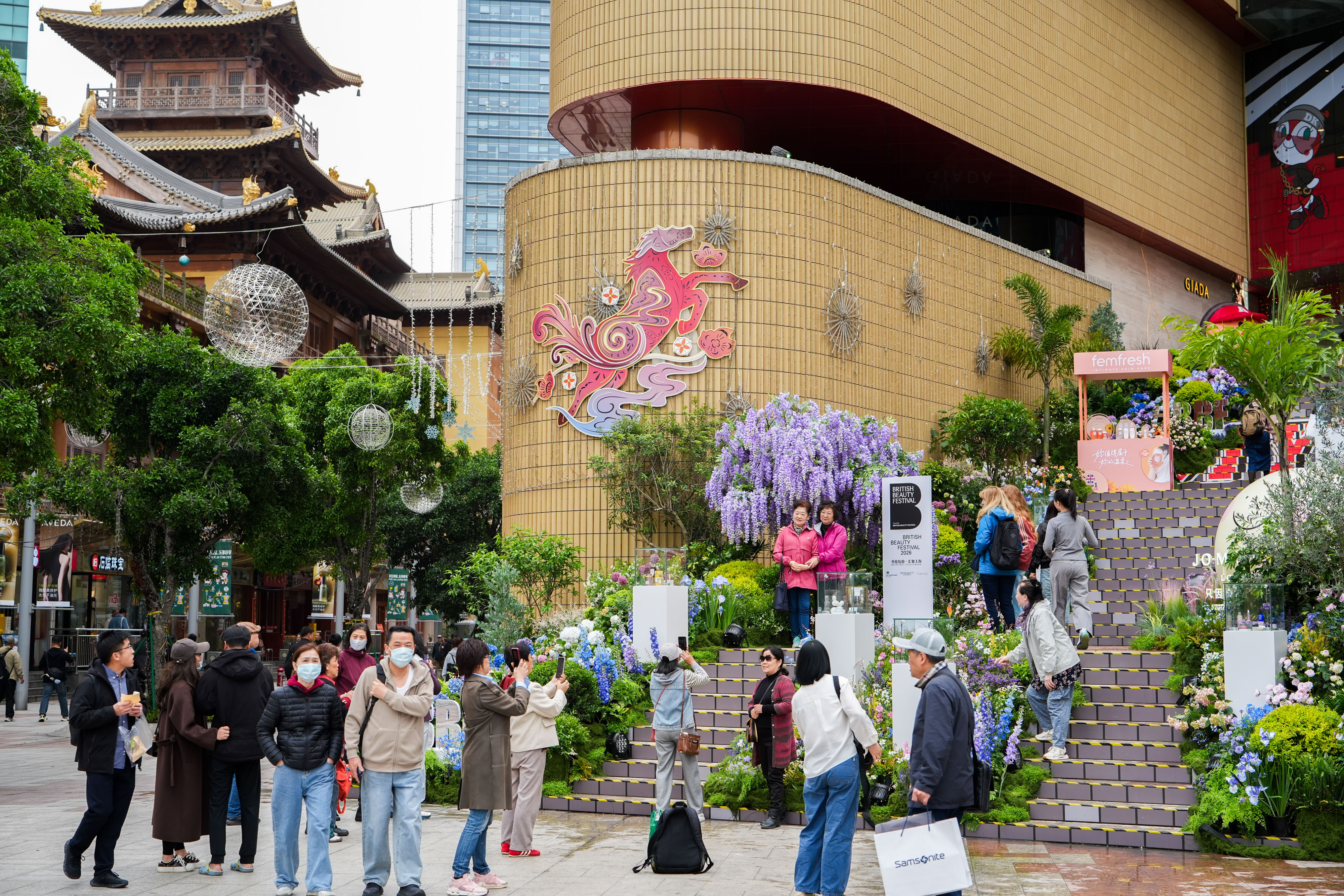 Passers-by stopping to photograph the installation on Nanjing West Road.