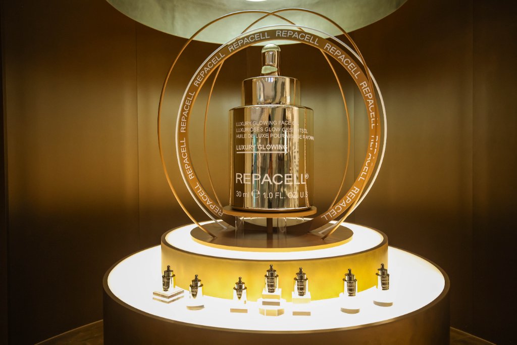 The Luxury Glowing Face Oil presented within a gilded orbital display