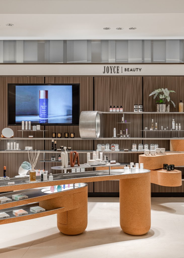 The JOYCE BEAUTY signage above the curated wall