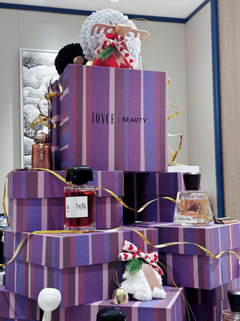 Fragrance detail against the striped gift boxes