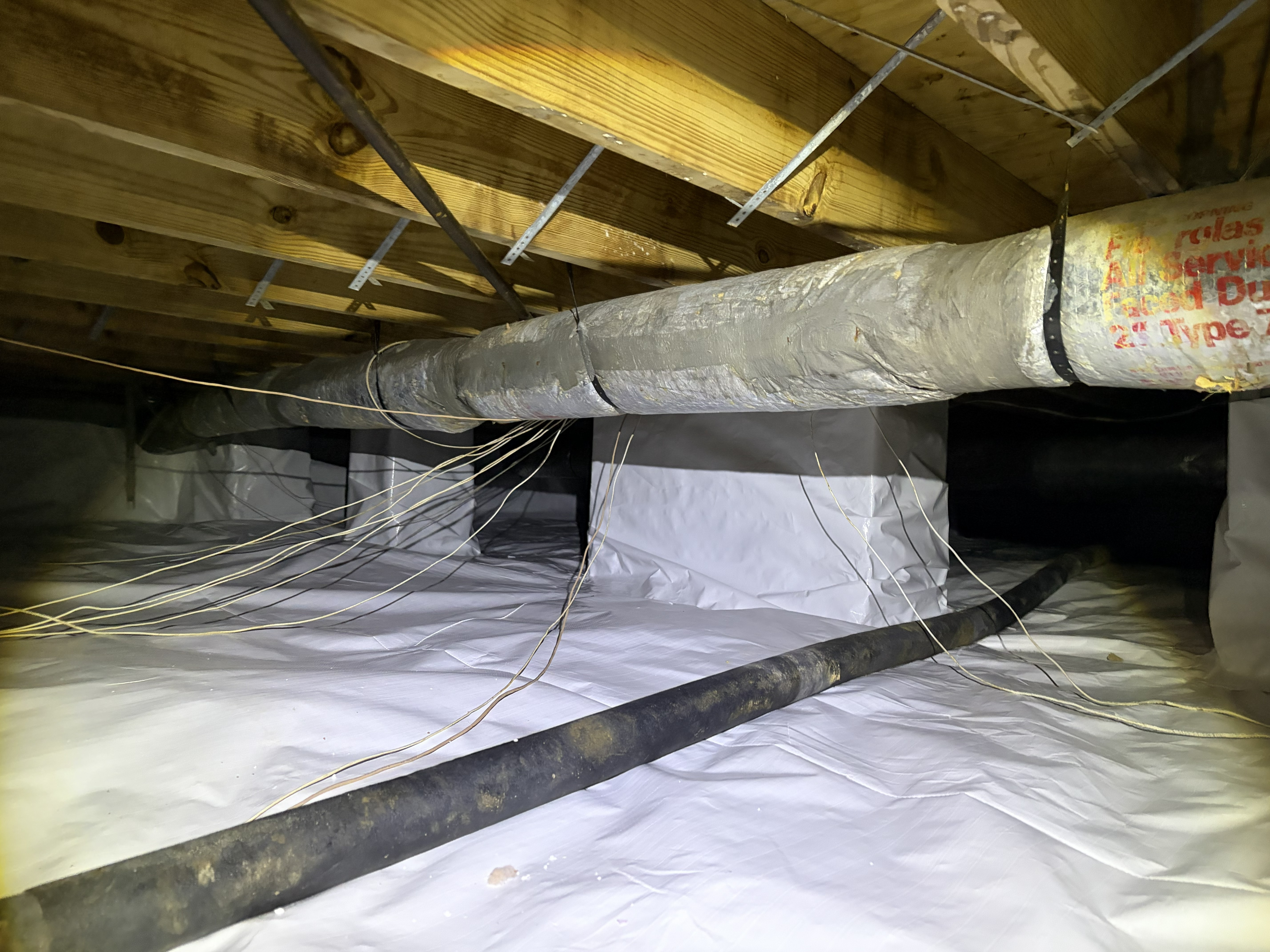 Clean encapsulated crawl space after fungal treatment in Murfreesboro, TN — vapor barrier and sealed HVAC ducting by The Crawl Shield