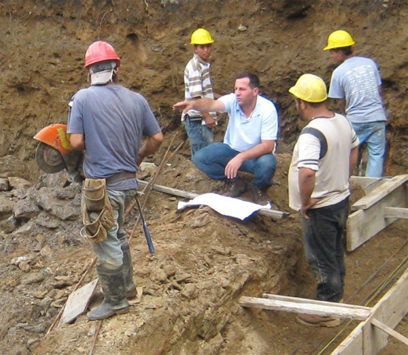 Kiri Construction team reviewing blueprints on a job site