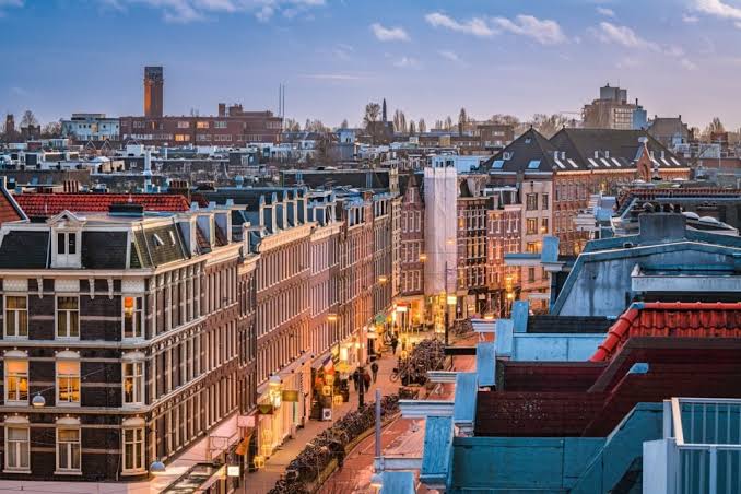 De Pijp rooftops at dusk — home of the LocalCircle