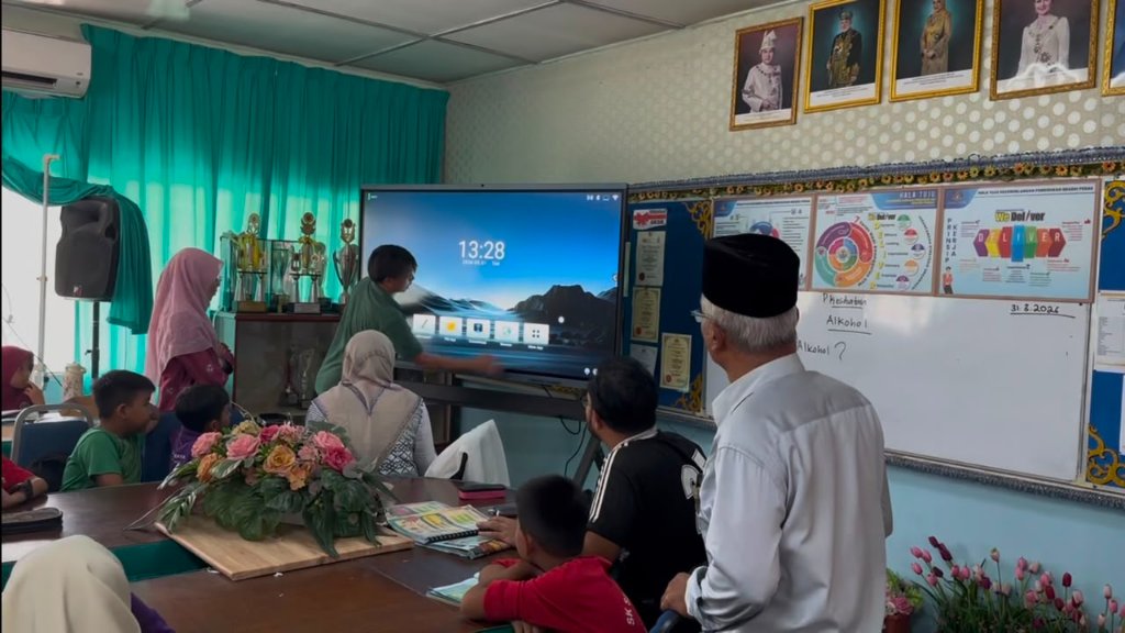 Modern Malaysian digital classroom with an interactive smart board in use