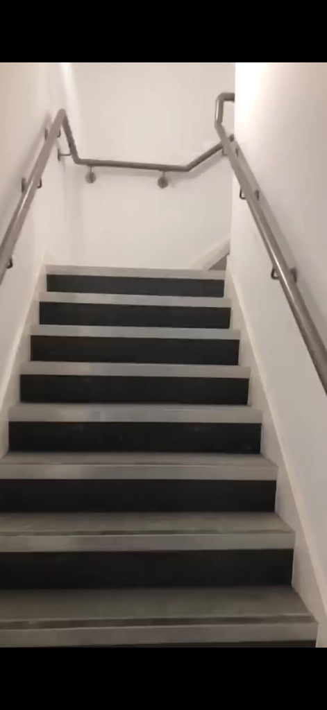 Interior Staircase with Metal Handrails