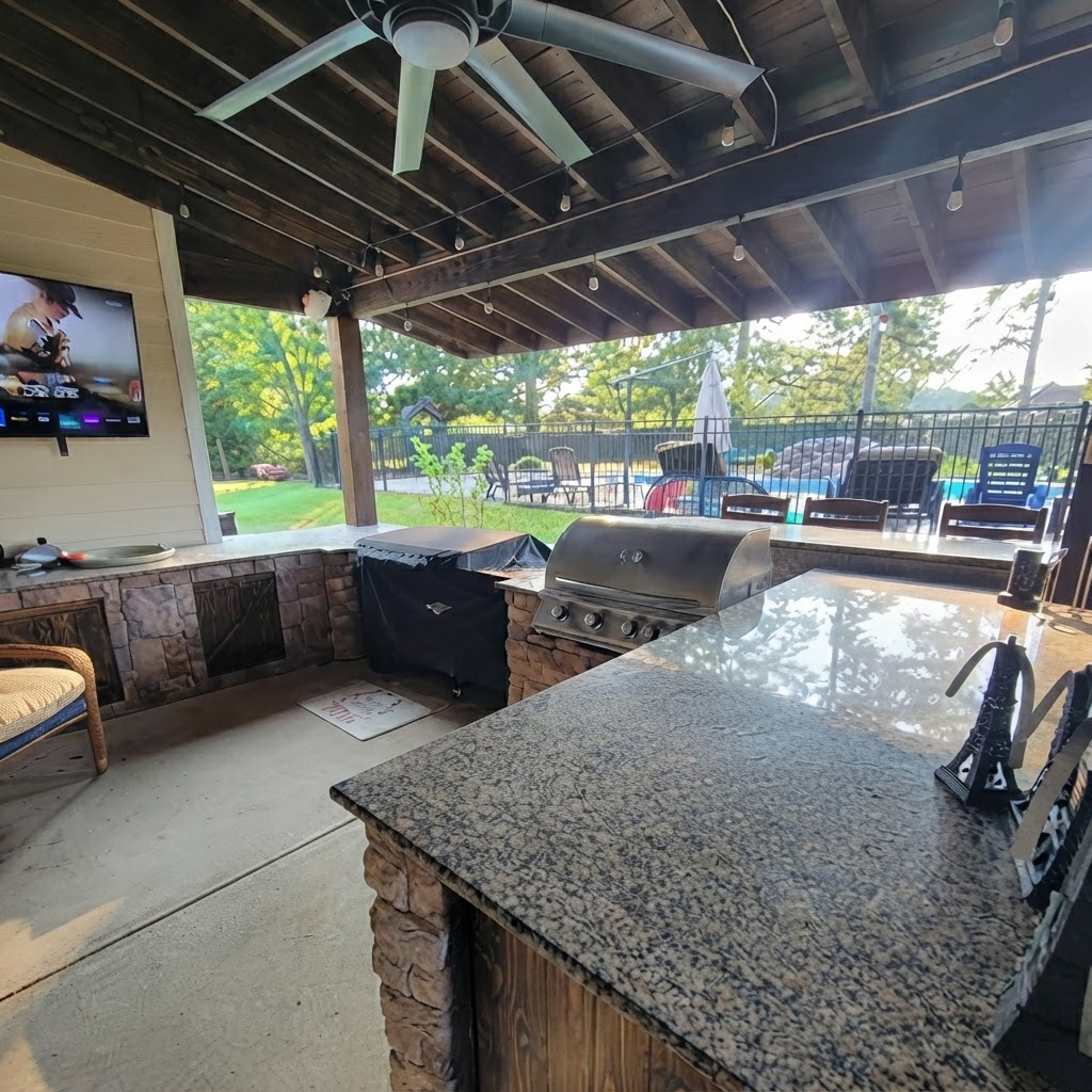 Outdoor kitchen with granite countertops and grill