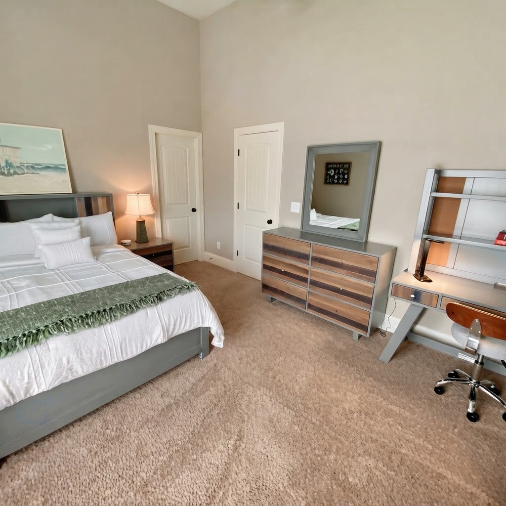 Bedroom with dark wood bed frame and wave art