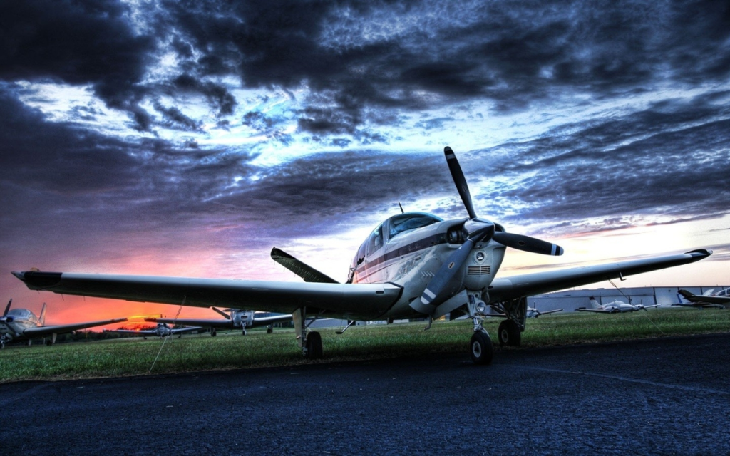 Beechcraft aircraft on tarmac at sunrise