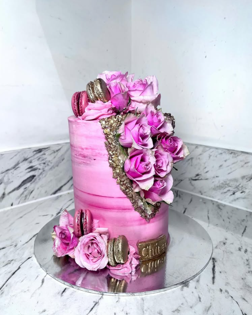 Luxury bespoke pink geode cake with gold accents and roses