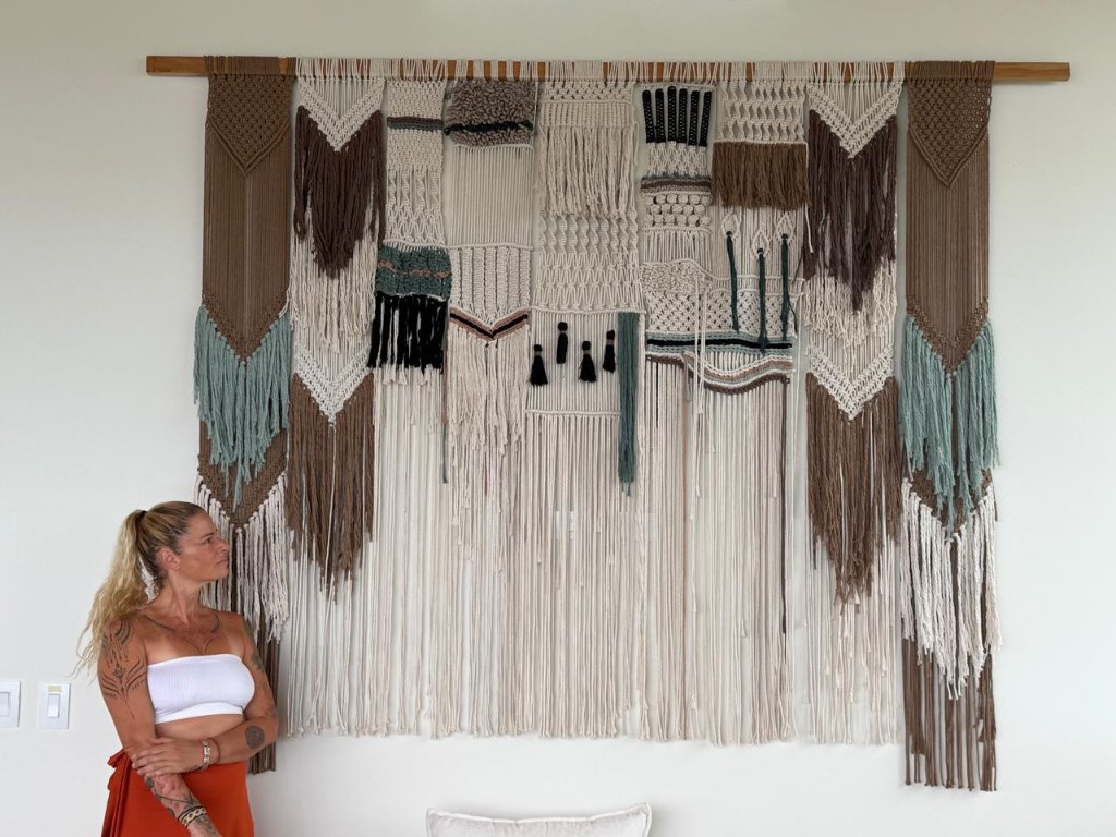 Macramé wall hanging with varied textures and earthy tones
