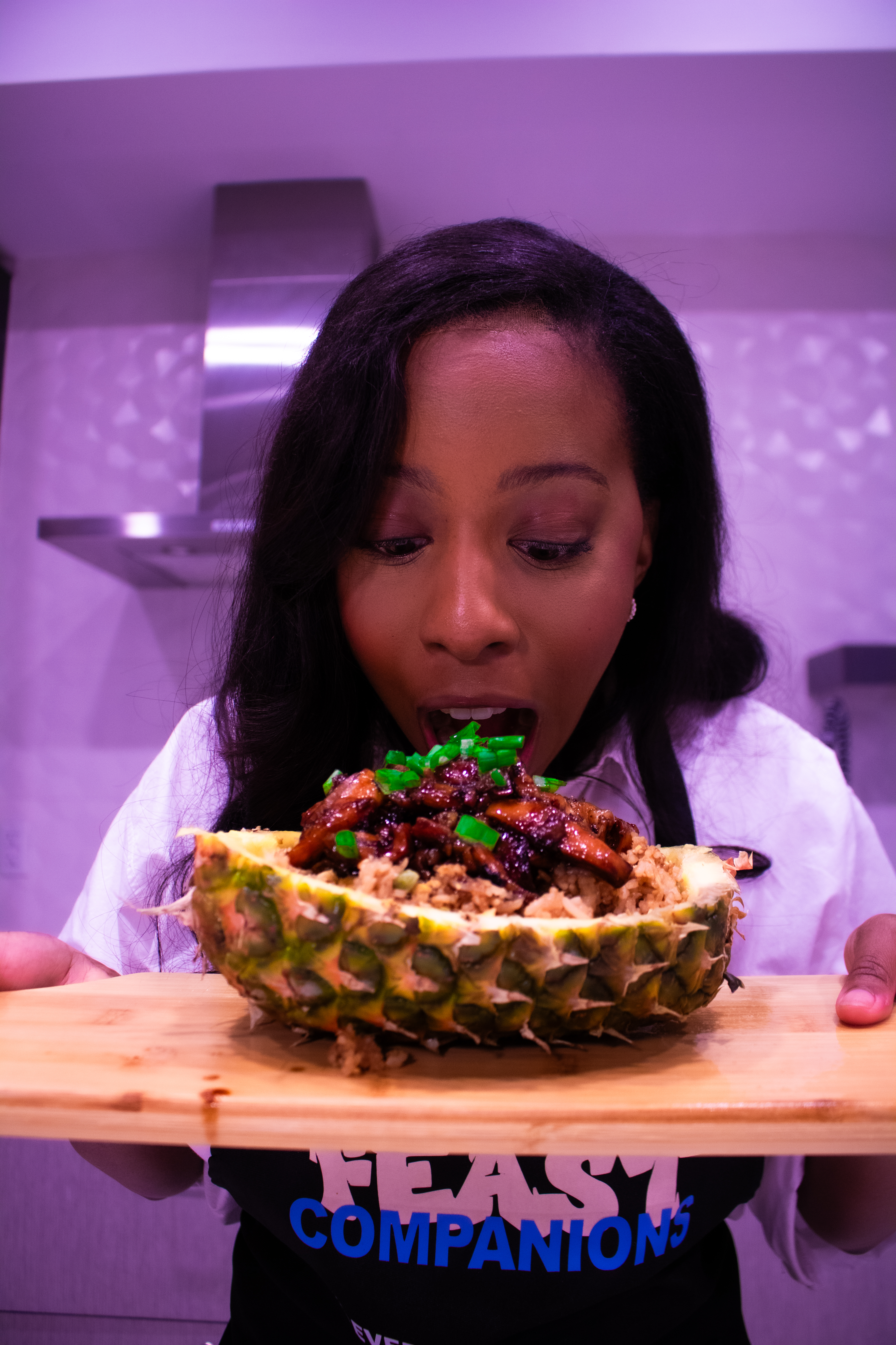 Feast Combinations, woman with pineapple dish