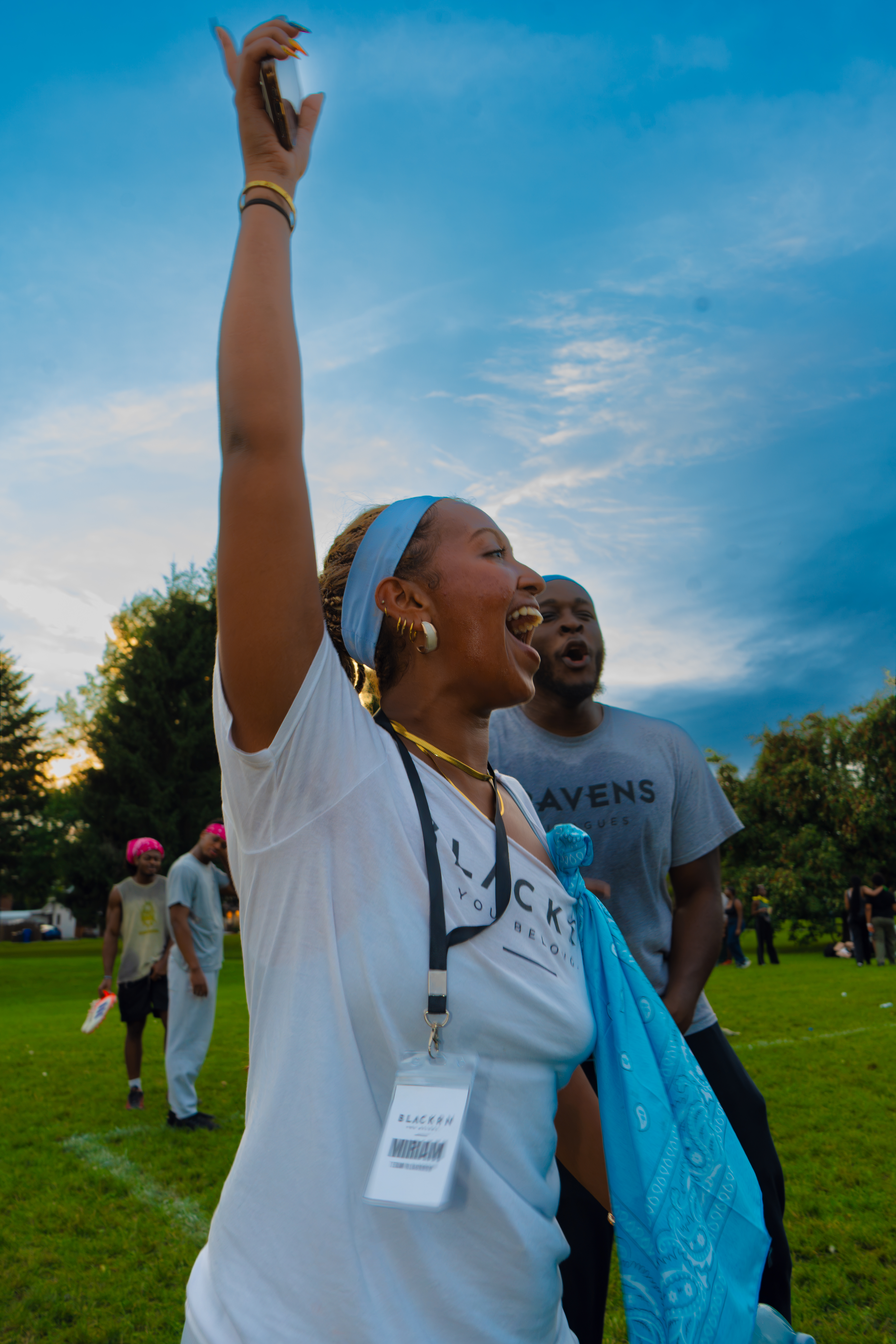 Woman celebrating at sunset