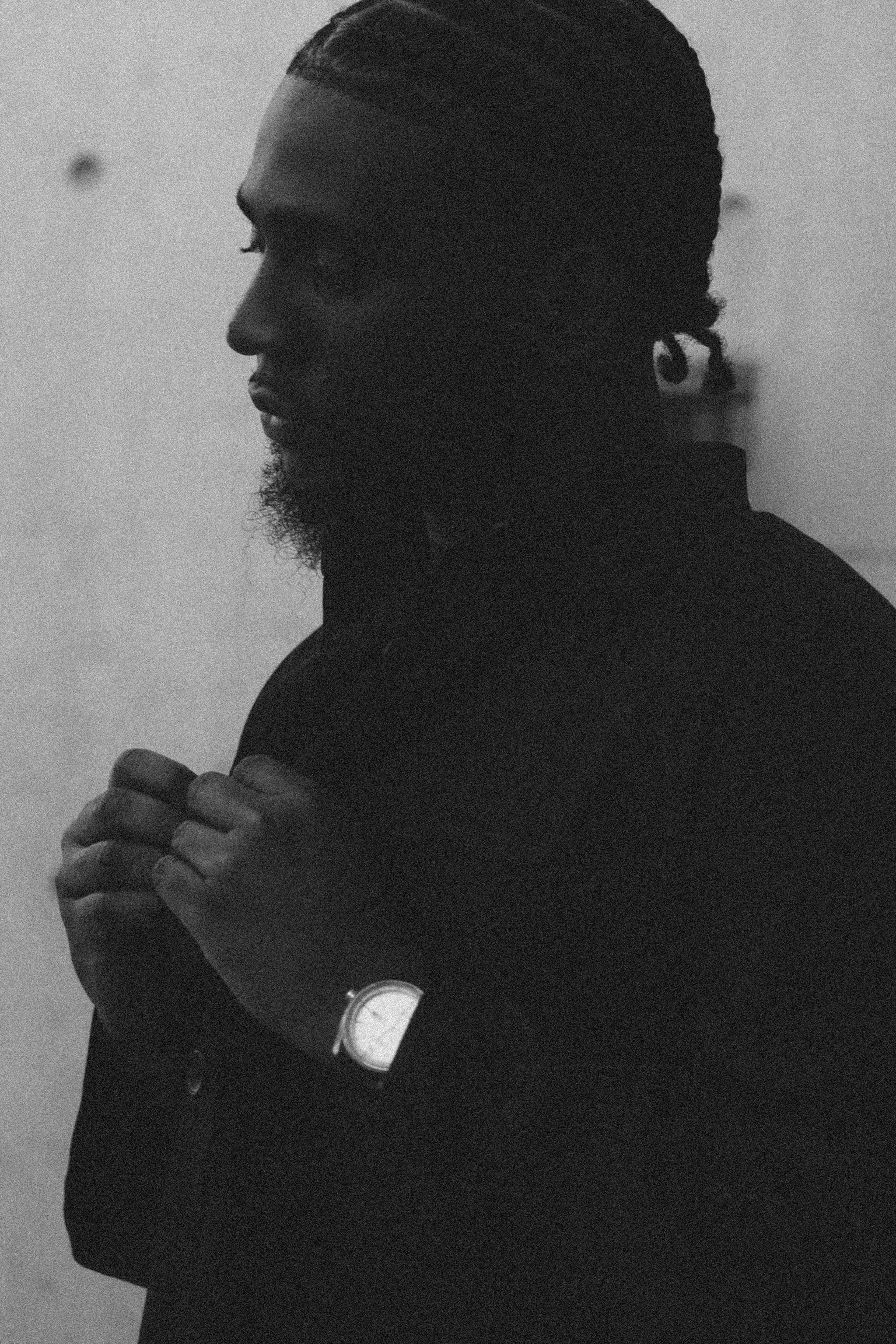 Black and white editorial portrait, profile