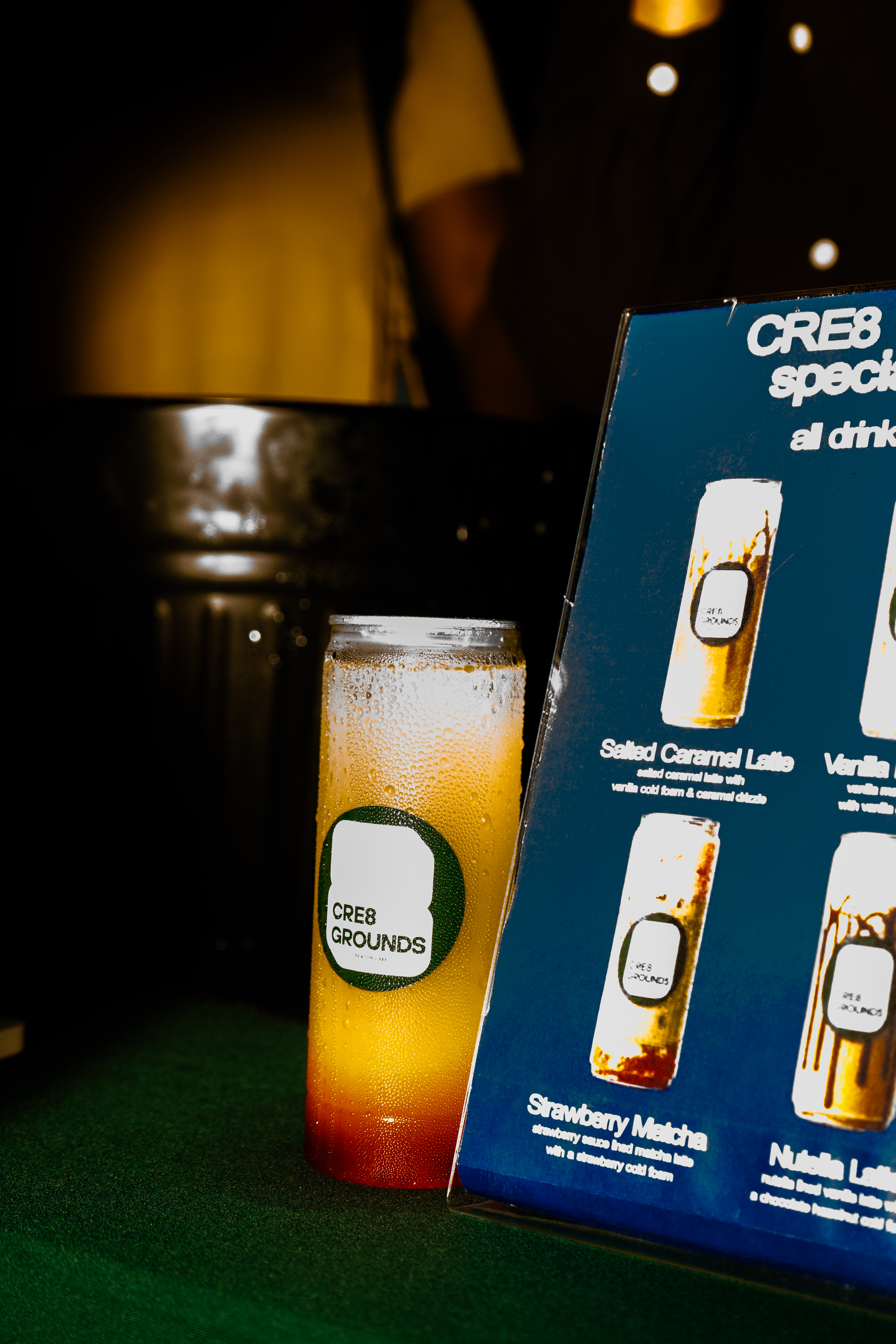 CRE8 Grounds drink and menu, moody interior