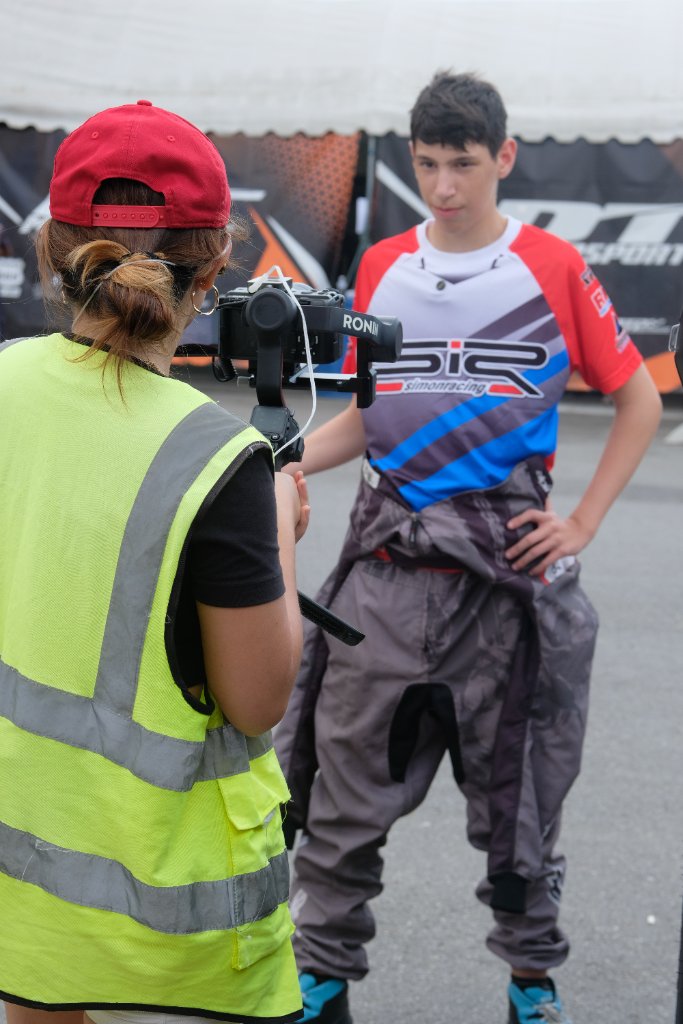Aira directing a racer during a documentary shoot