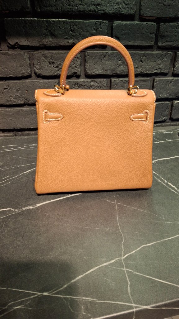 Back view of Hermès Kelly bag showing rear panel and handle