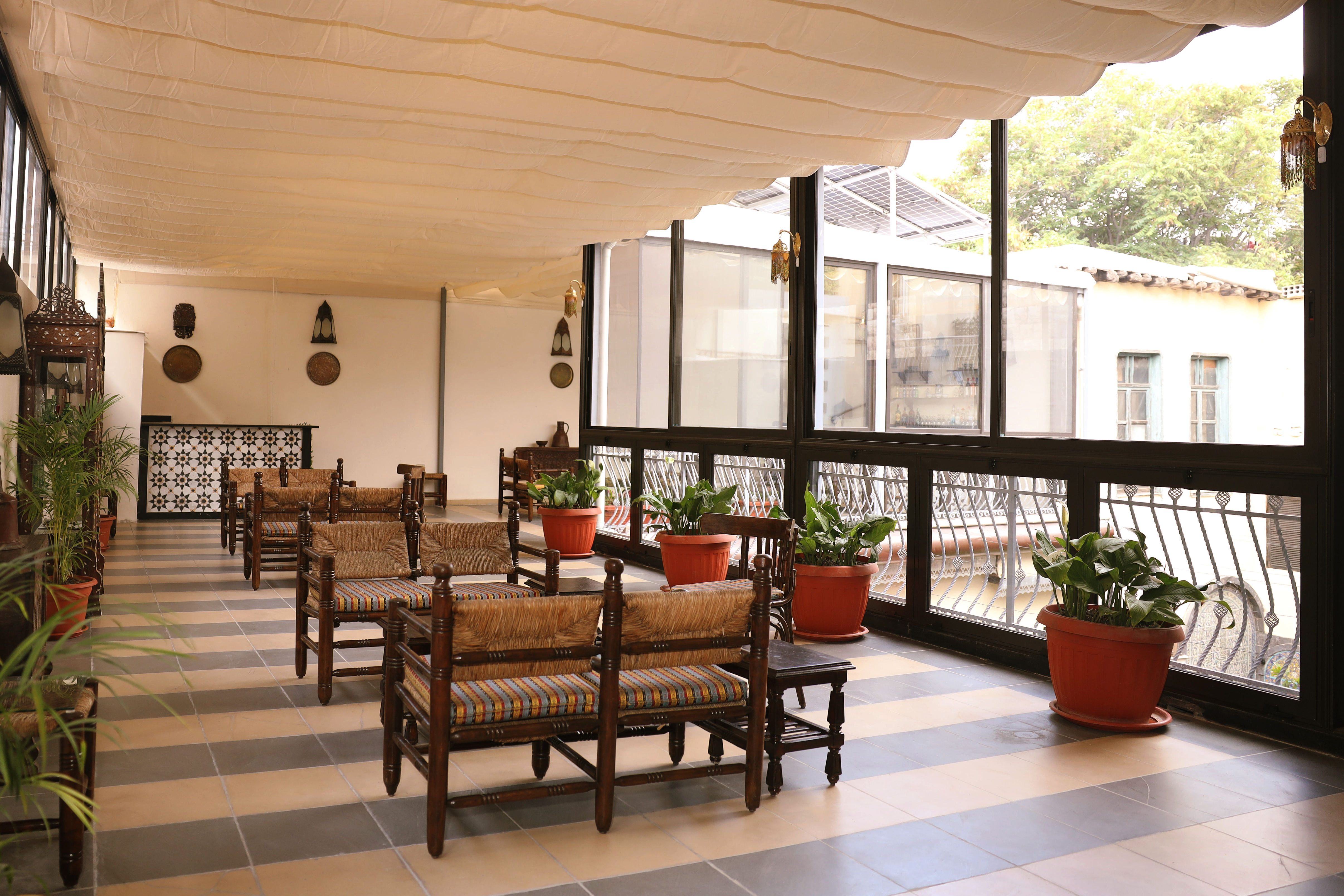 Terrace Guest Lounge — full-length windows onto the terrace