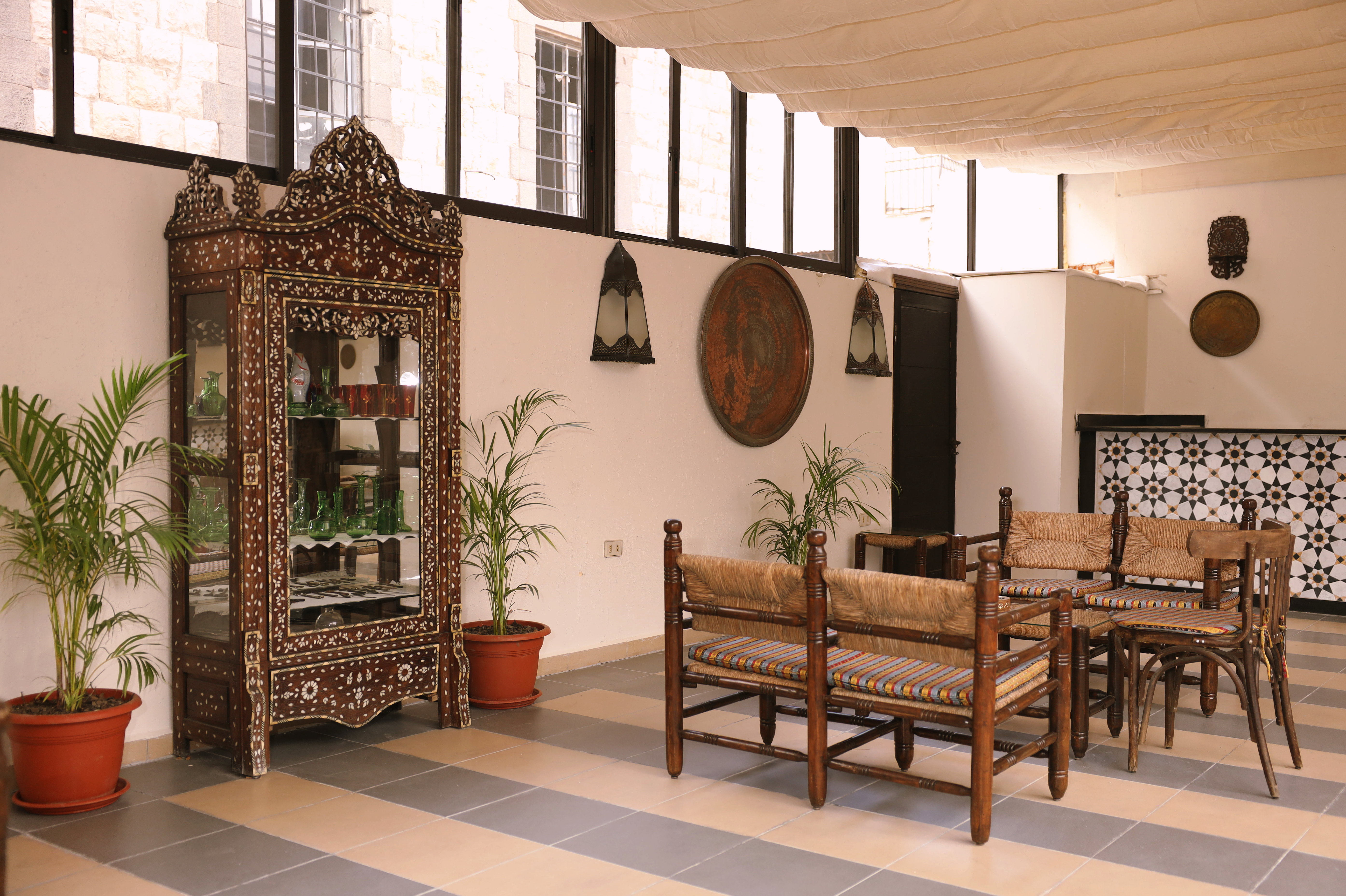 Terrace Guest Lounge — carved cabinet and seating