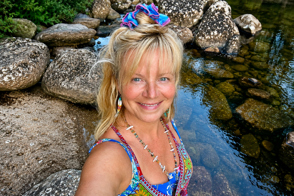 Woman at rocky shoreline
