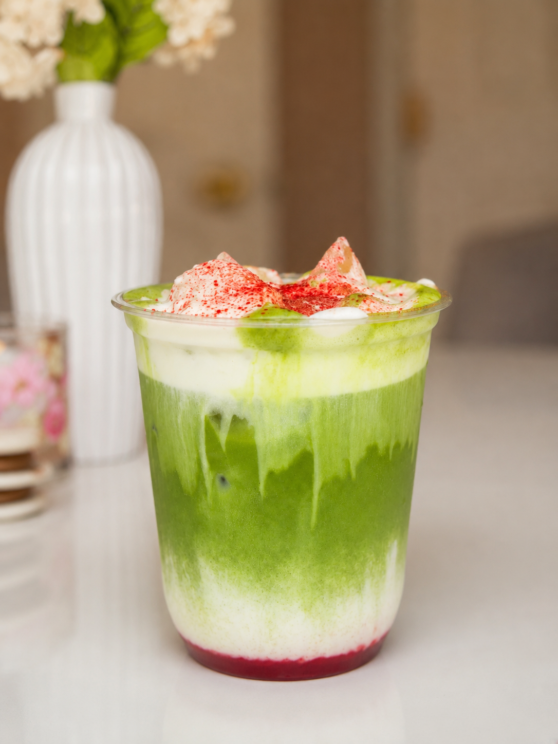 Fresh strawberry matcha latte whisked to order by Koffee Roots