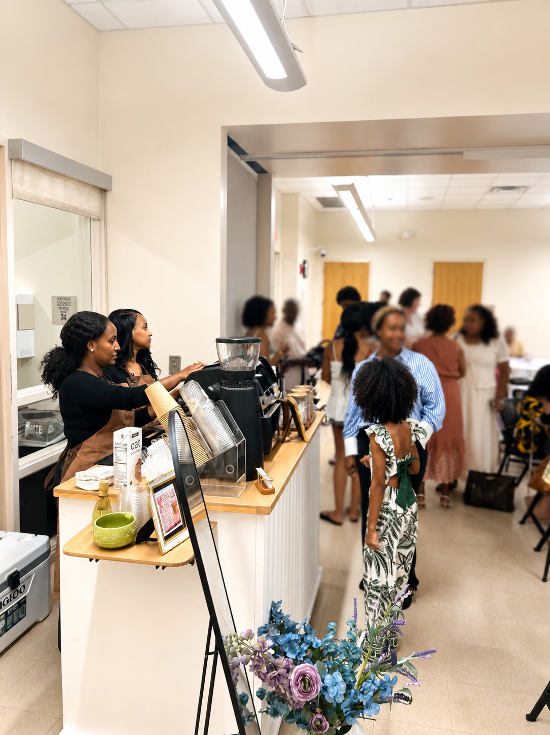Koffee Roots baristas serving guests