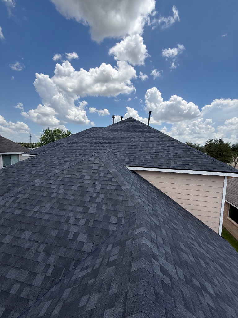 Completed charcoal shingle roof replacement on a Houston home