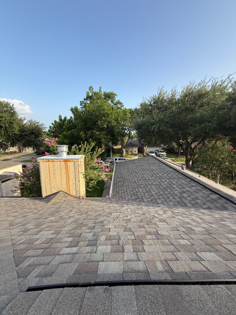 Storm damage shingle repair underway on Houston home