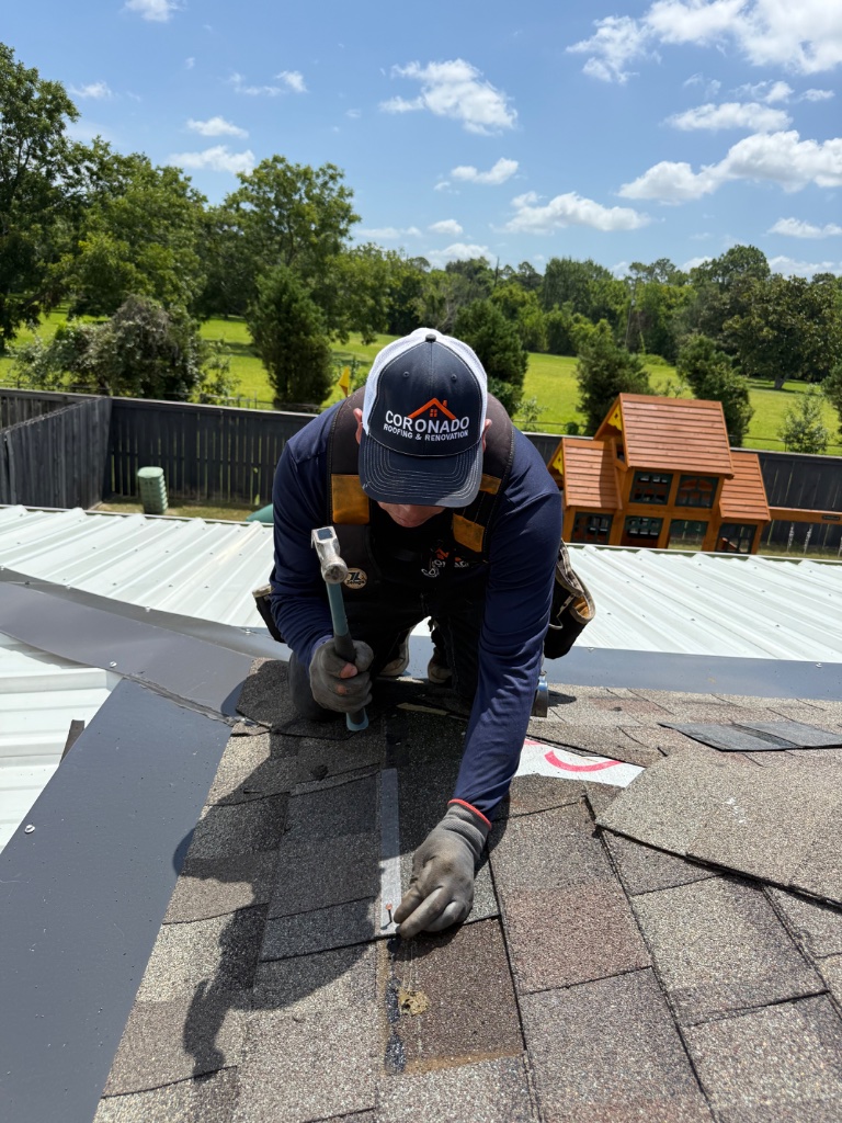 Roof repair in progress by Coronado Roofing crew