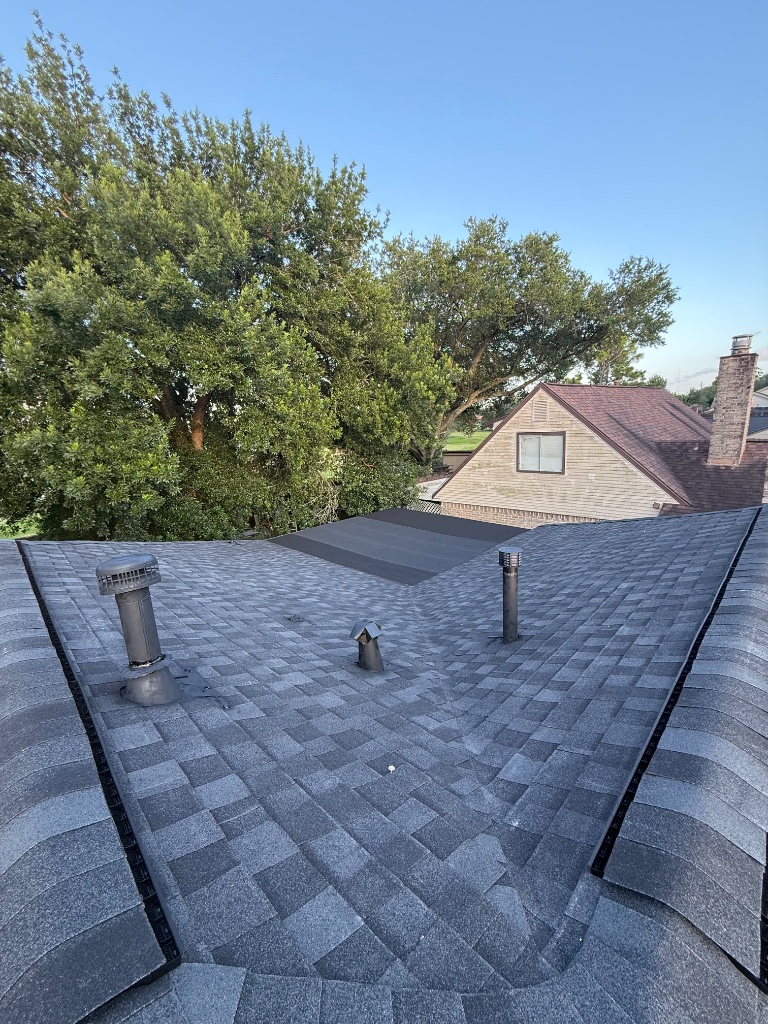 Routine roof maintenance on a shingle roof