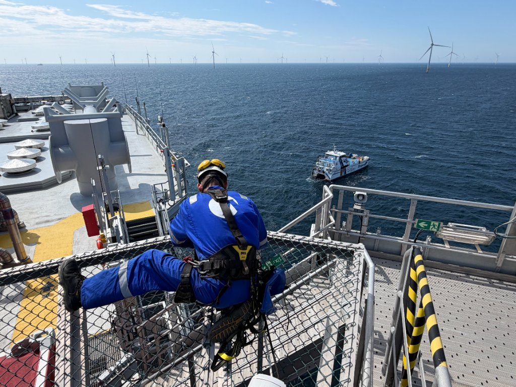 Rope access technician on offshore wind turbine platform