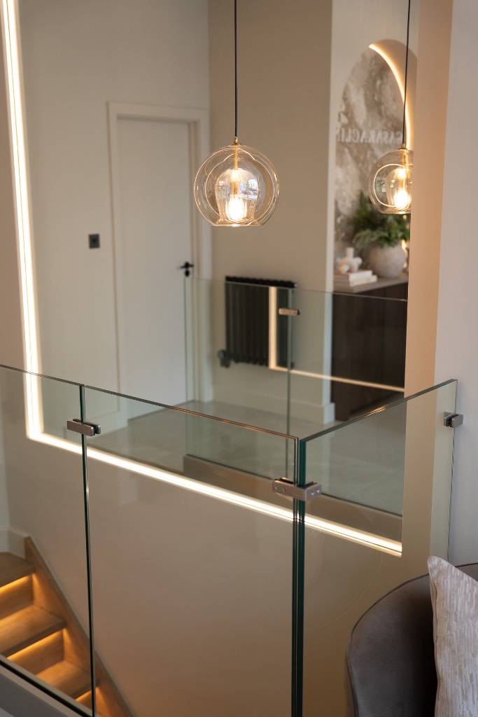 Staircase landing with pendant lights