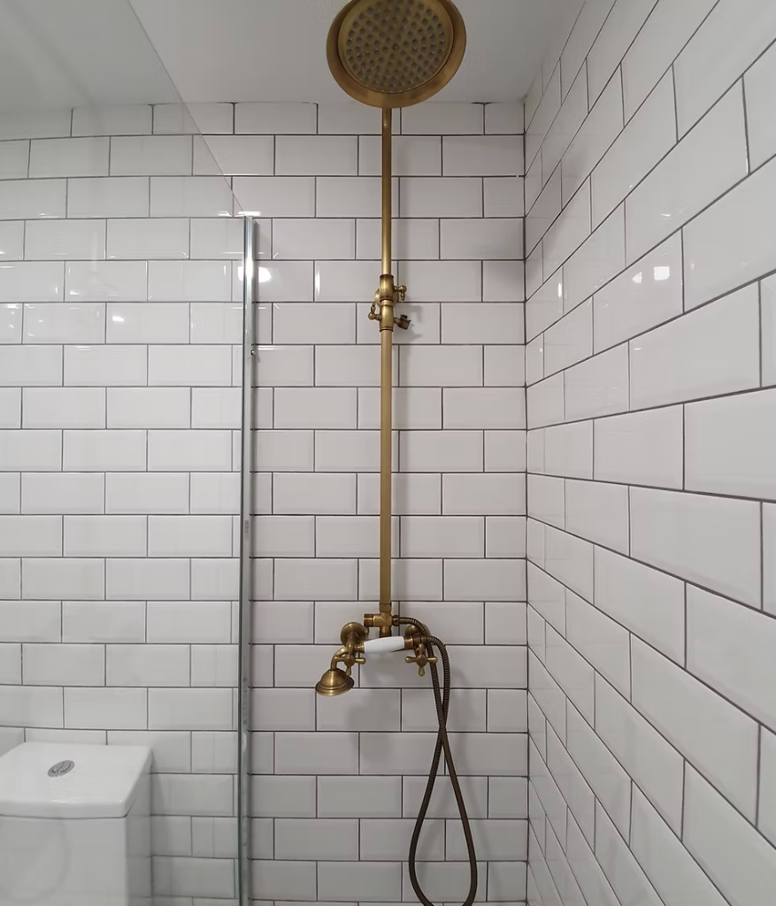 Brass shower fixture installation for a bathroom renovation in Tauranga