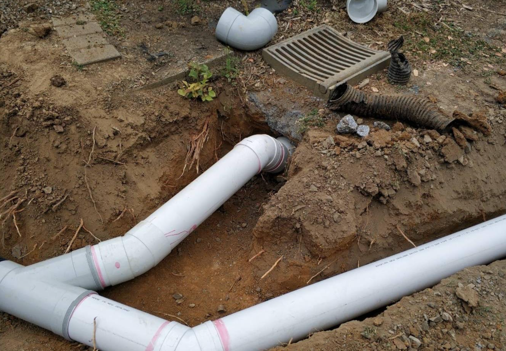 Drain repair with new PVC pipes installed in an excavated trench in Tauranga