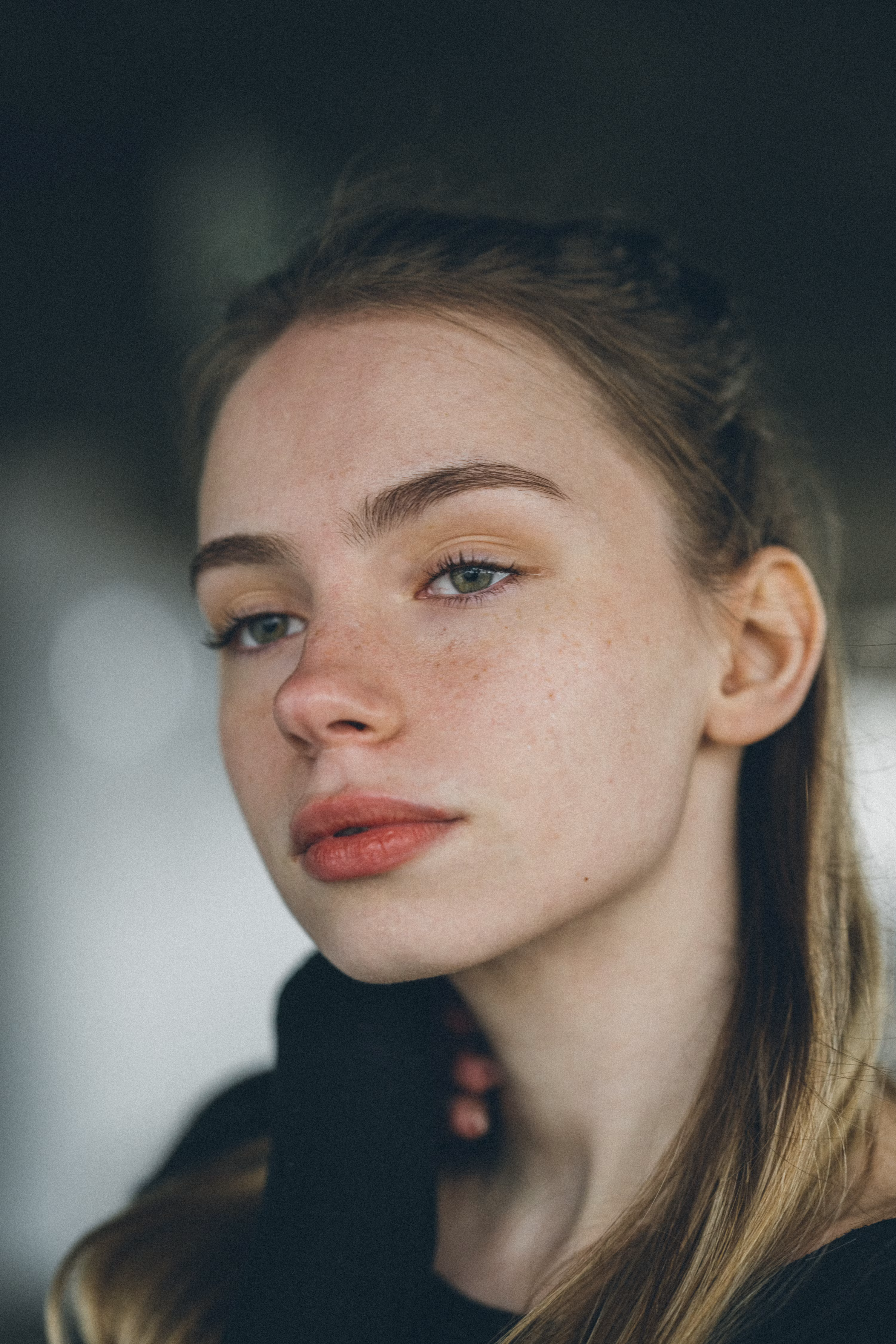 Editorial portrait of a woman with warm natural coloring