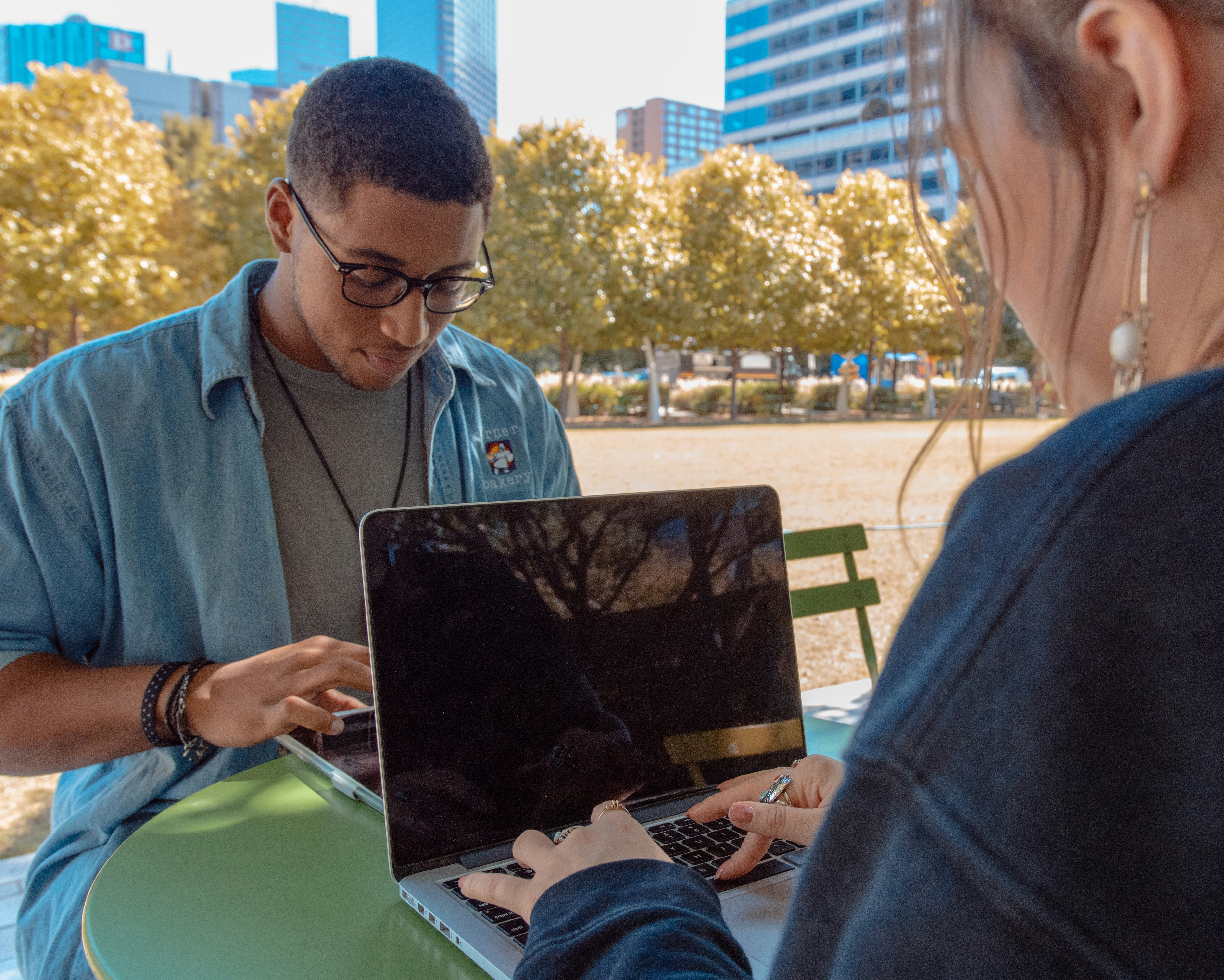Two people working together outdoors