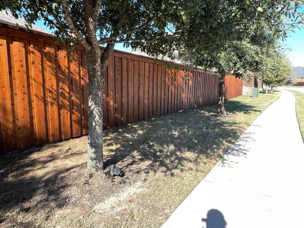 Exterior wood trim painting on residential home in Texoma