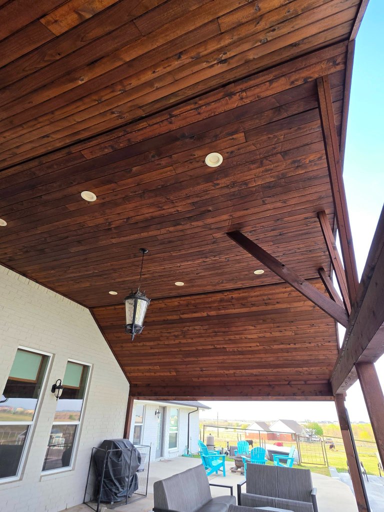 Freshly stained cedar fence in Sherman TX