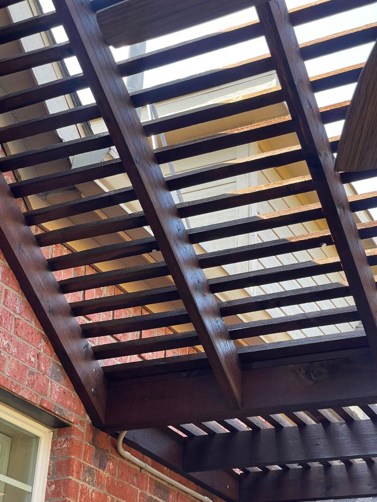 Restored exterior wood siding with fresh stain finish