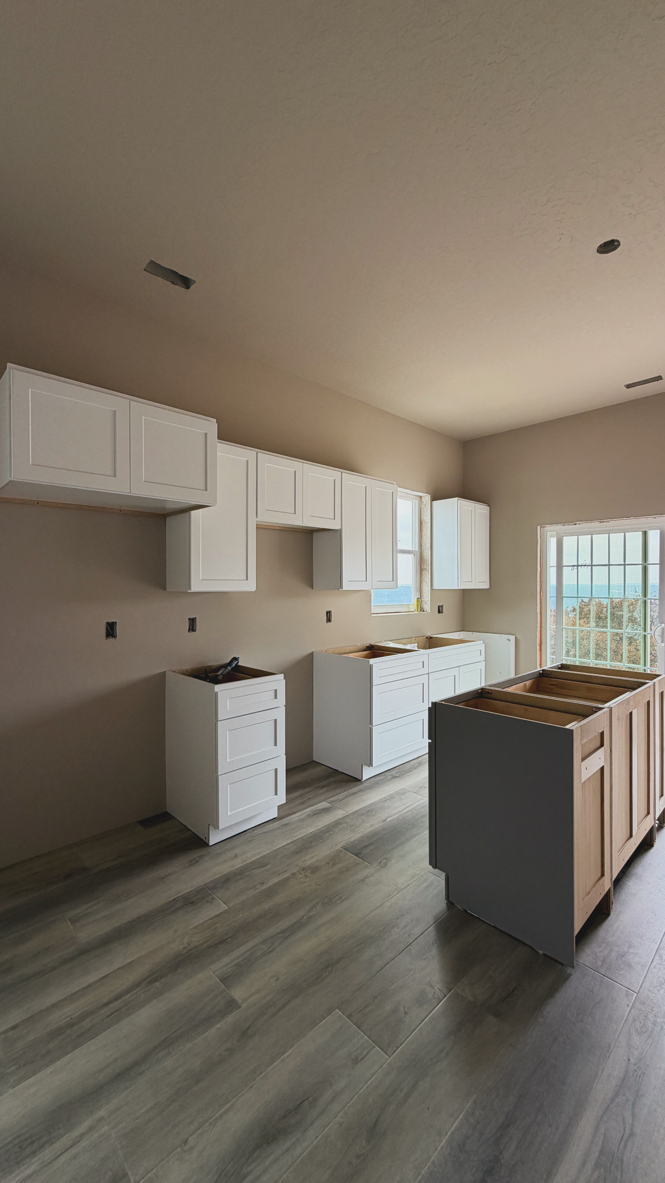 White Shaker kitchen with island build underway