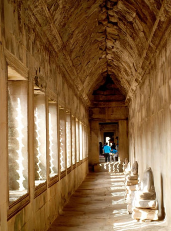 Ancient stone corridor at Angkor Wat temple complex in Siem Reap, Cambodia