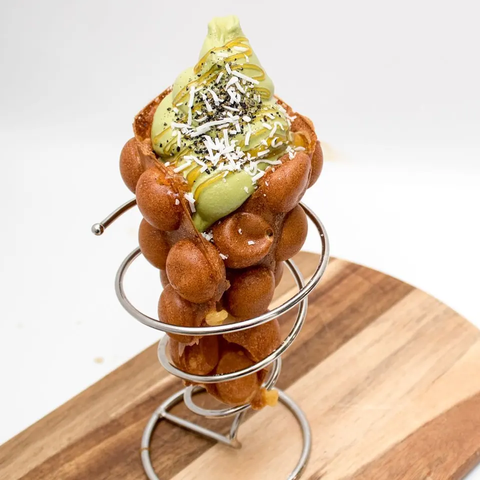 Matcha soft serve, coconut and sesame in a golden Muffle