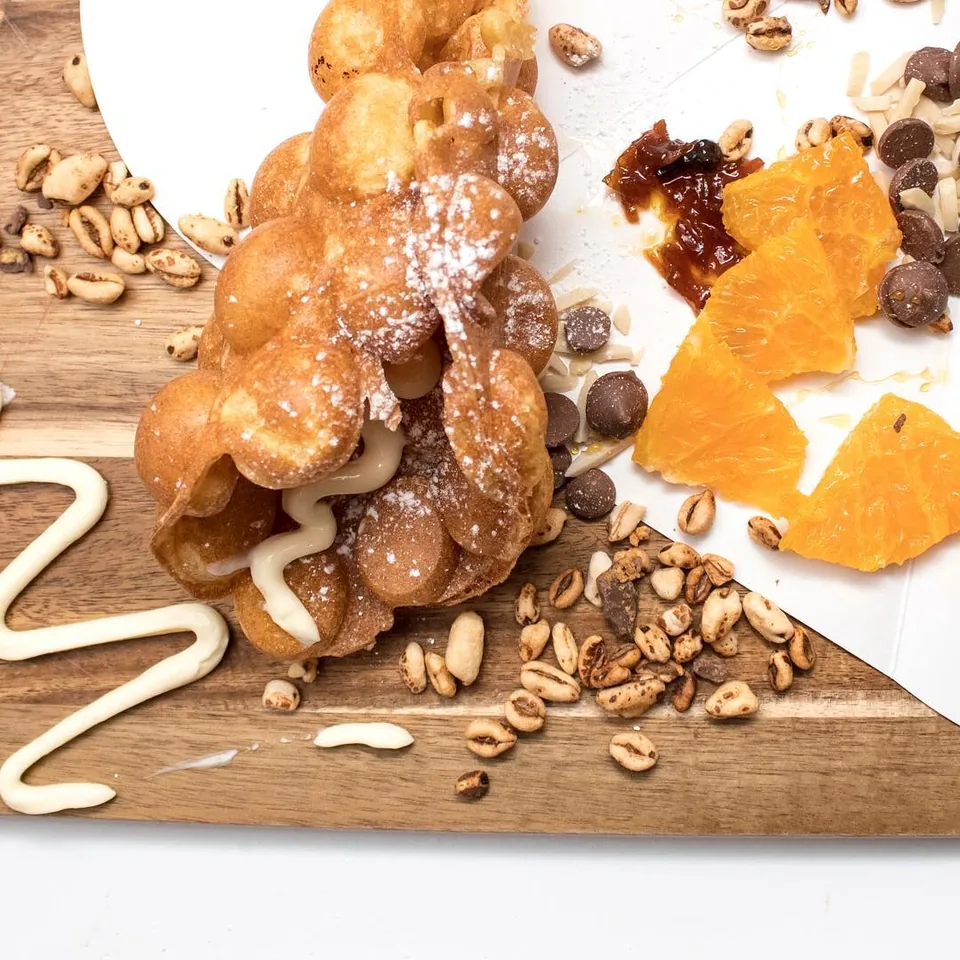 Golden Muffles arranged with chocolate, nuts and toppings