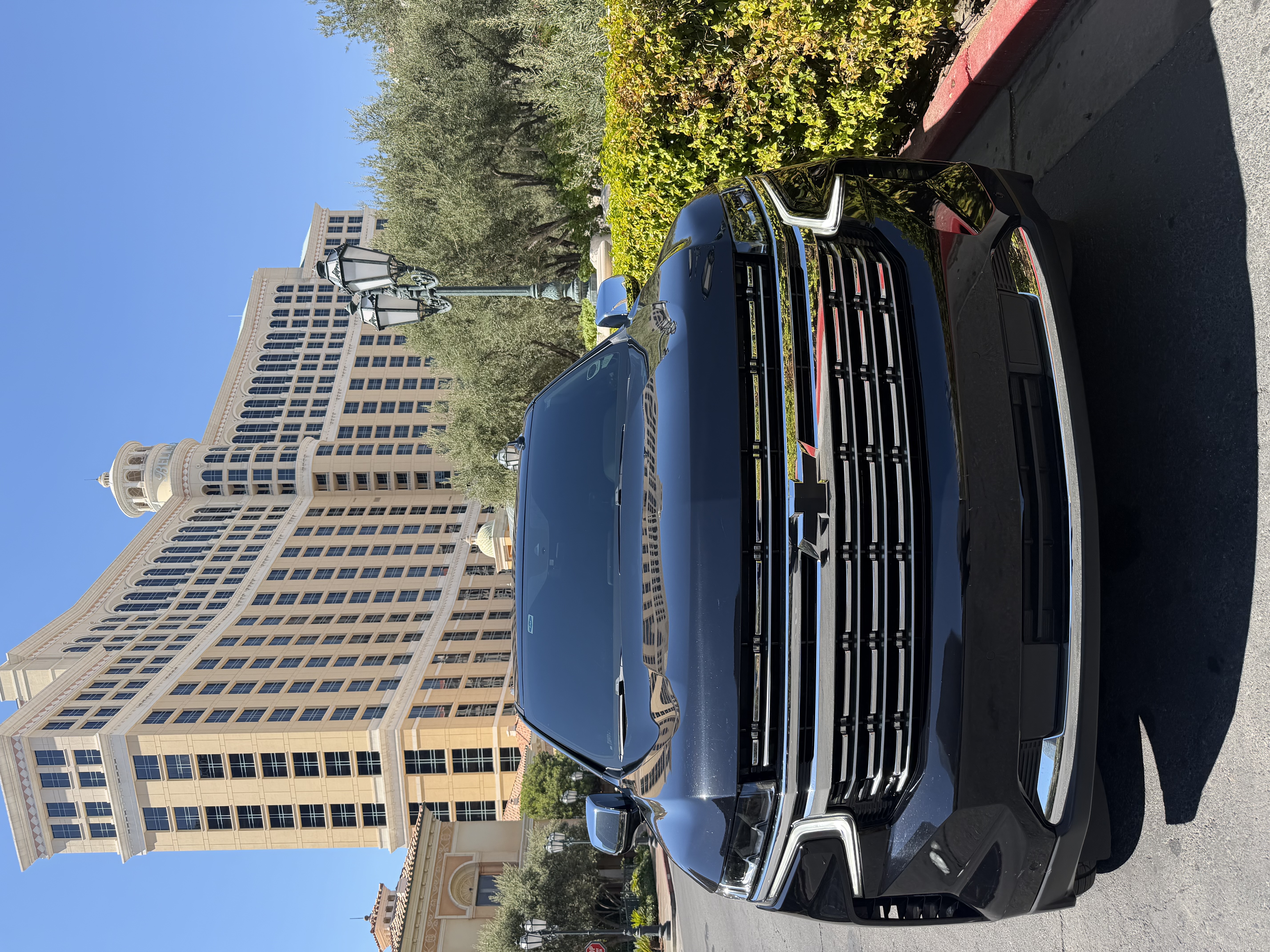 Black Chevrolet Suburban head-on view in front of the Bellagio in Las Vegas