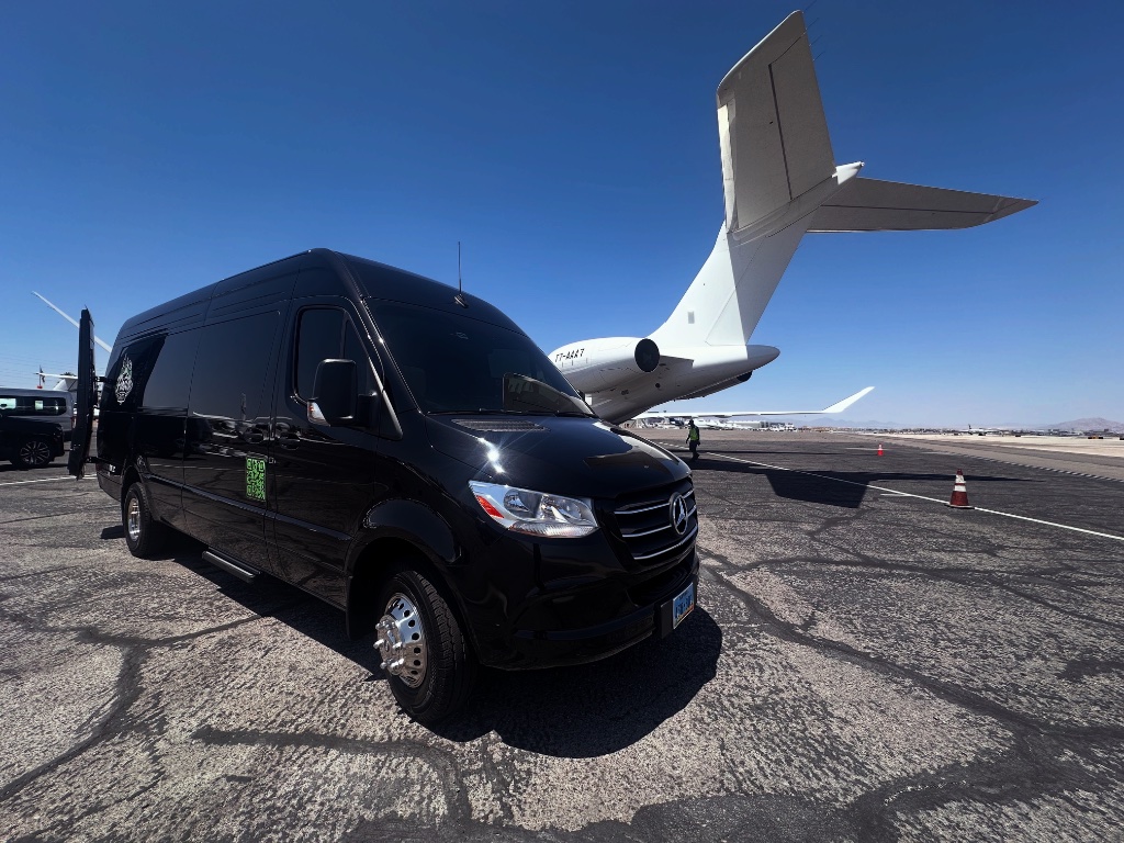 Black Mercedes Sprinter limo on tarmac