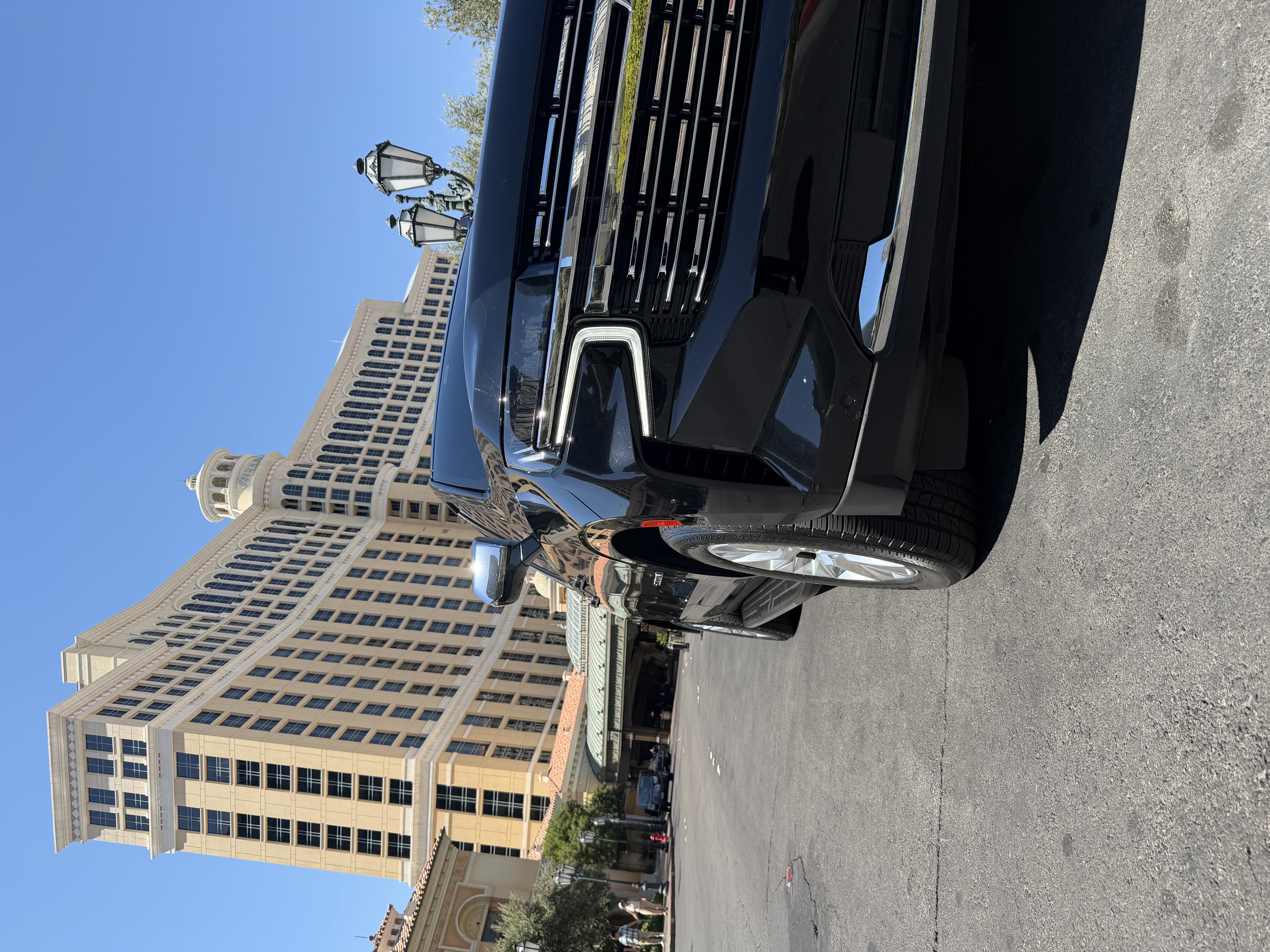 Black Cadillac Escalade parked in front of the Bellagio Hotel and Casino in Las Vegas