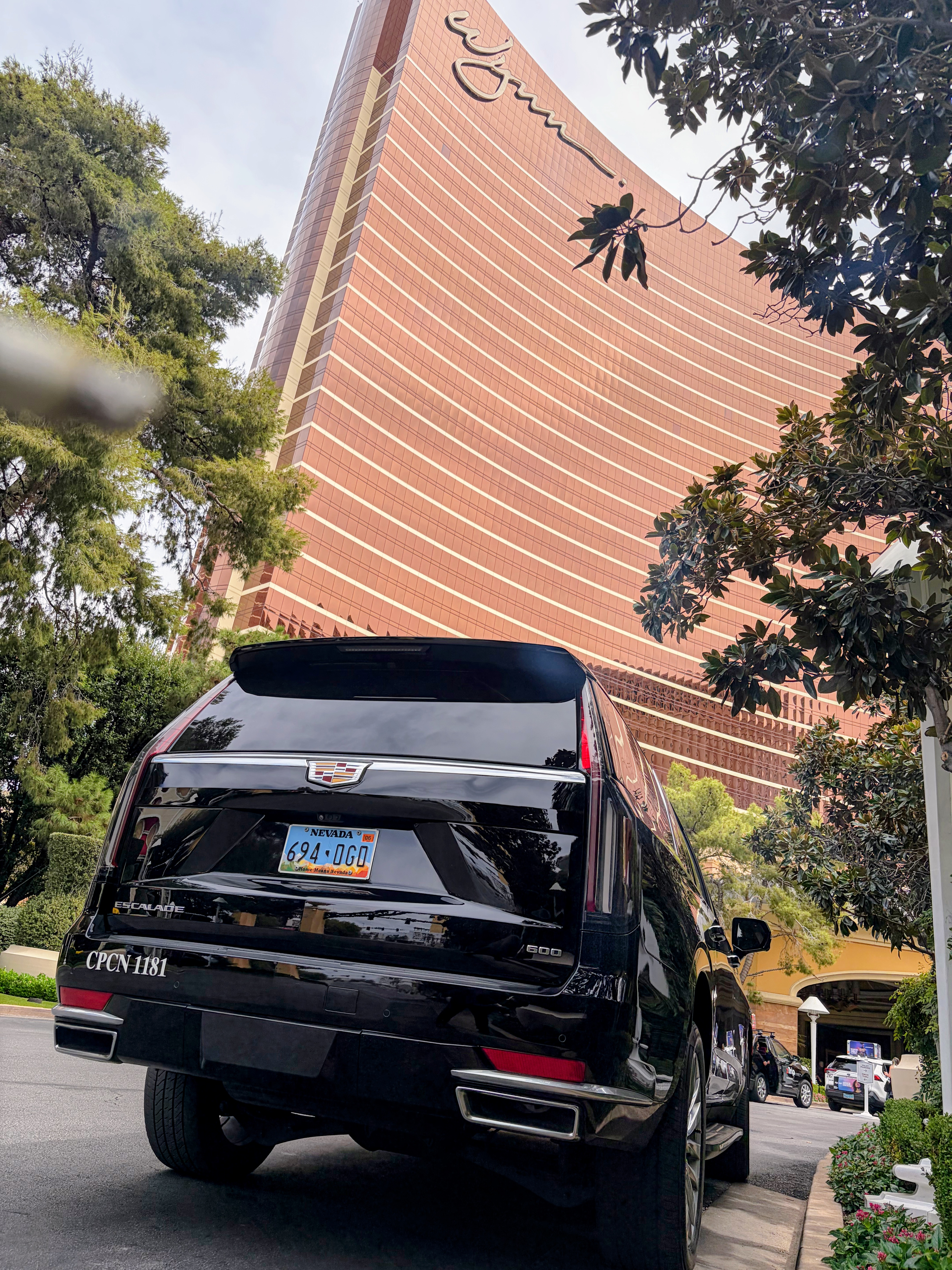Black Cadillac Escalade rear three-quarter view at the Wynn Las Vegas with Viva Limo CPCN 1181